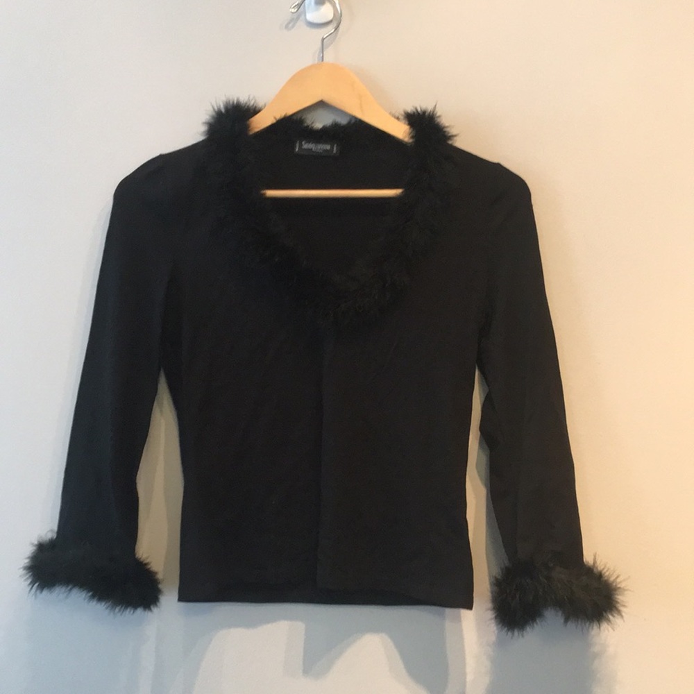 Black long sleeve top with feather